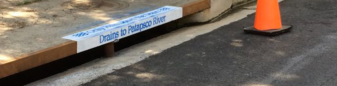 Stormwater drain with drainage destination painted
